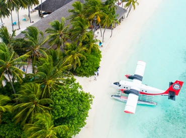 a plane landing on the coastline